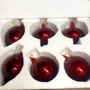 Two sets of red glass balsam hill ornaments.